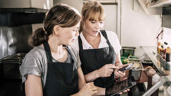 Gordon Food Service - chefs checking food orders on phones